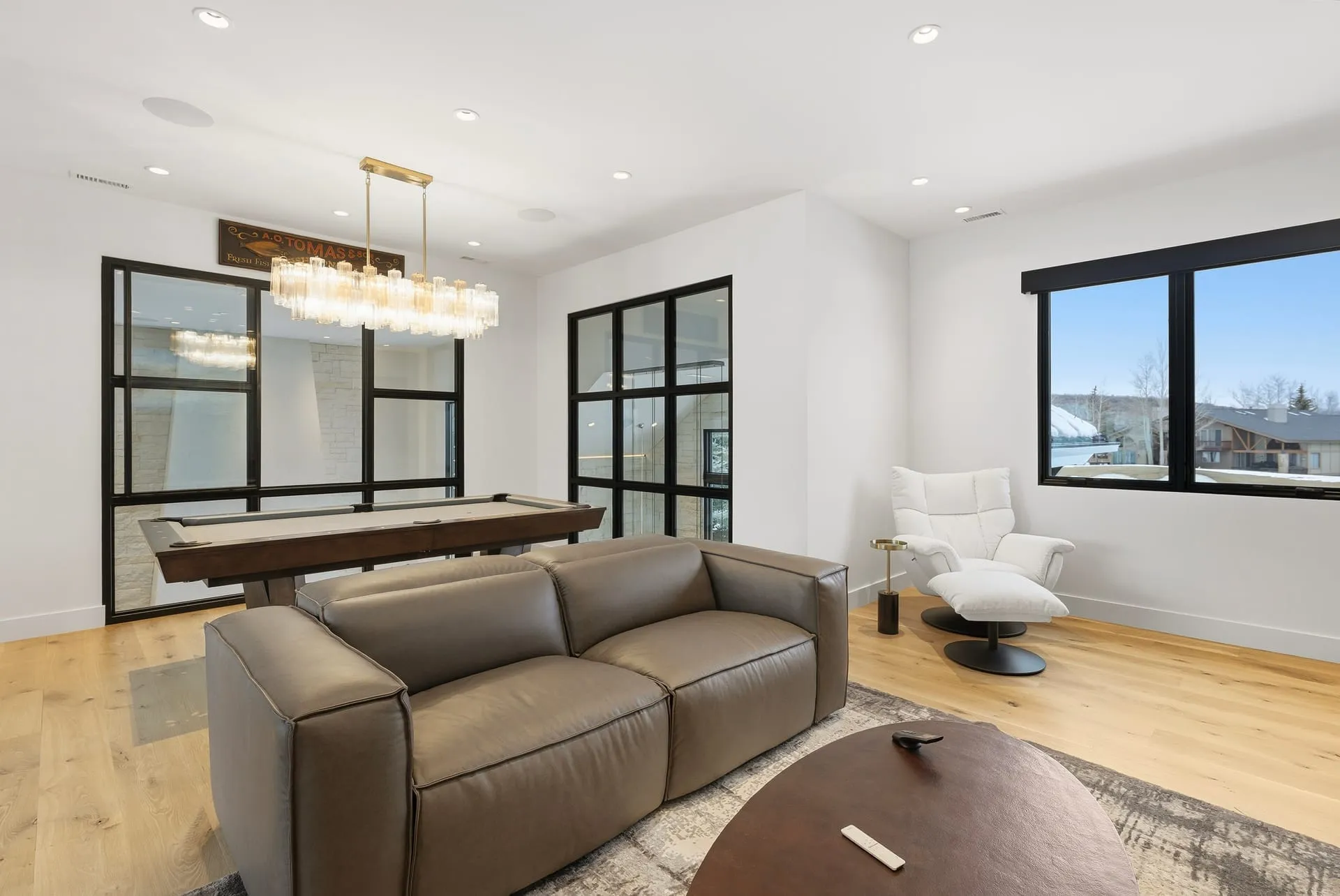 Lounge linear chandelier pool view