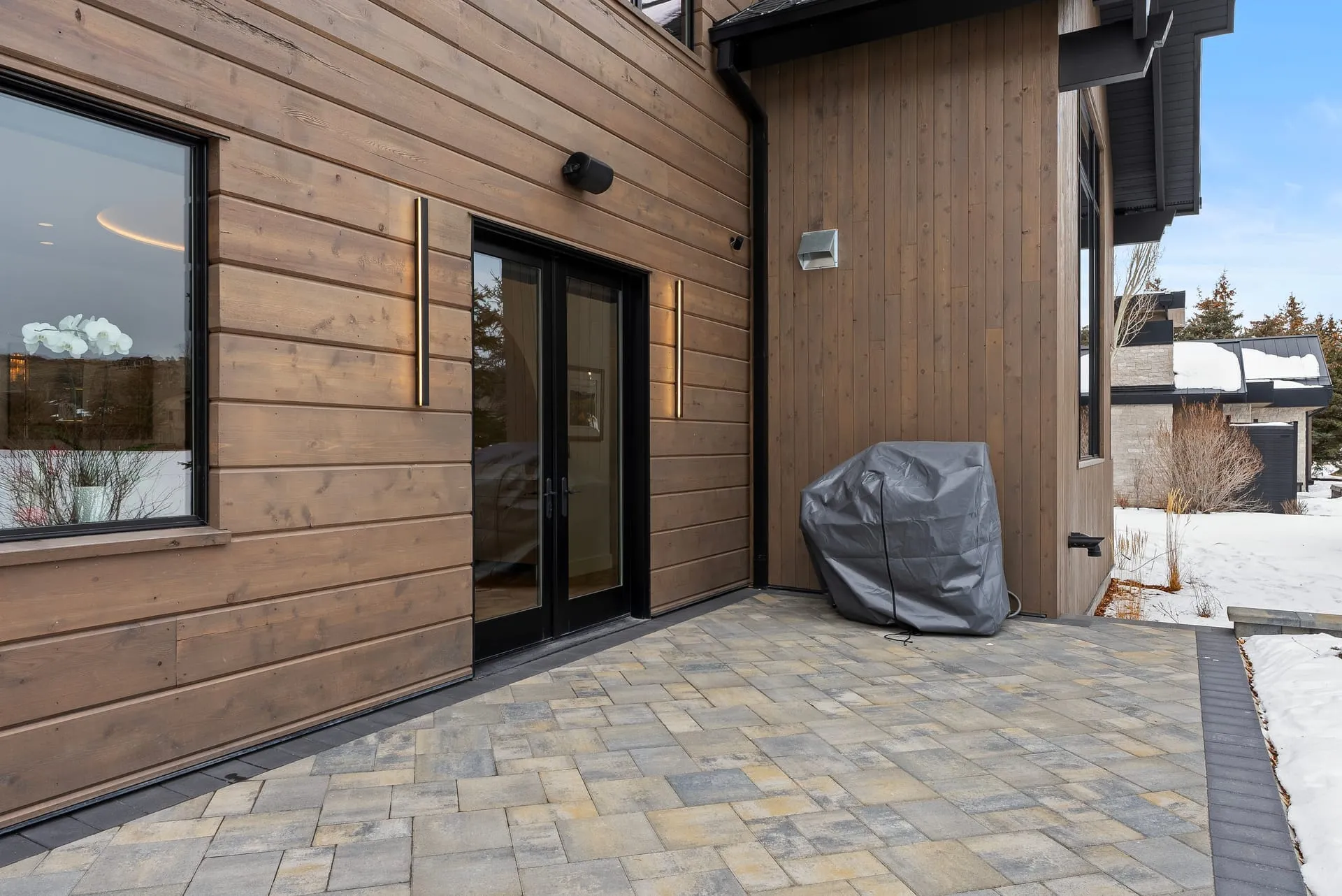 Side patio wood clad sconces