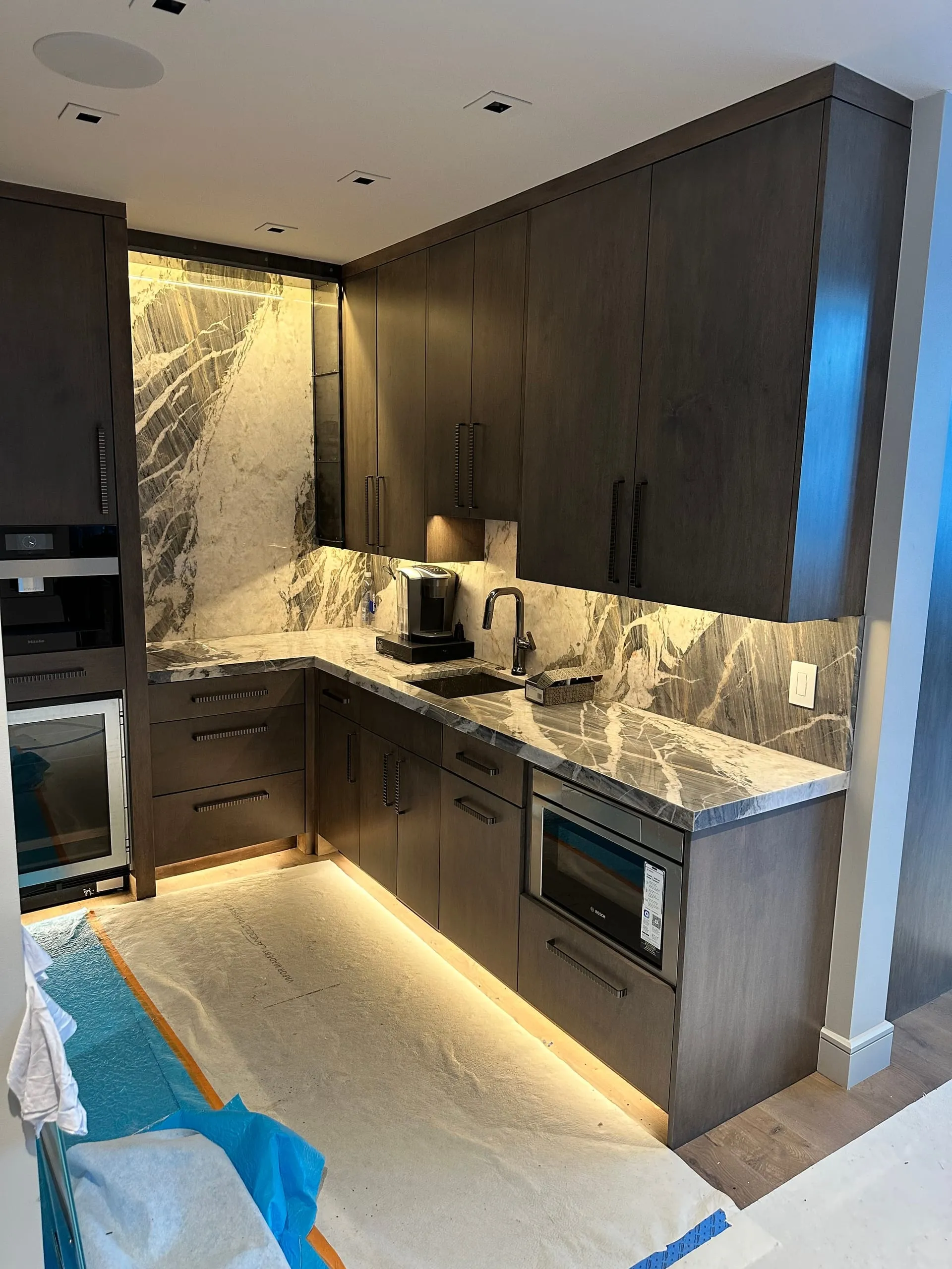 Dark kitchen marble LED toe kick