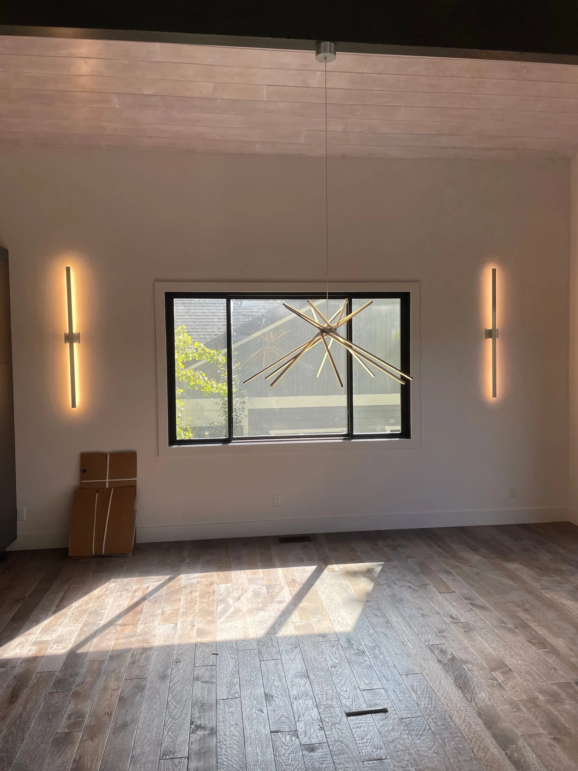 Linear sconces starburst chandelier