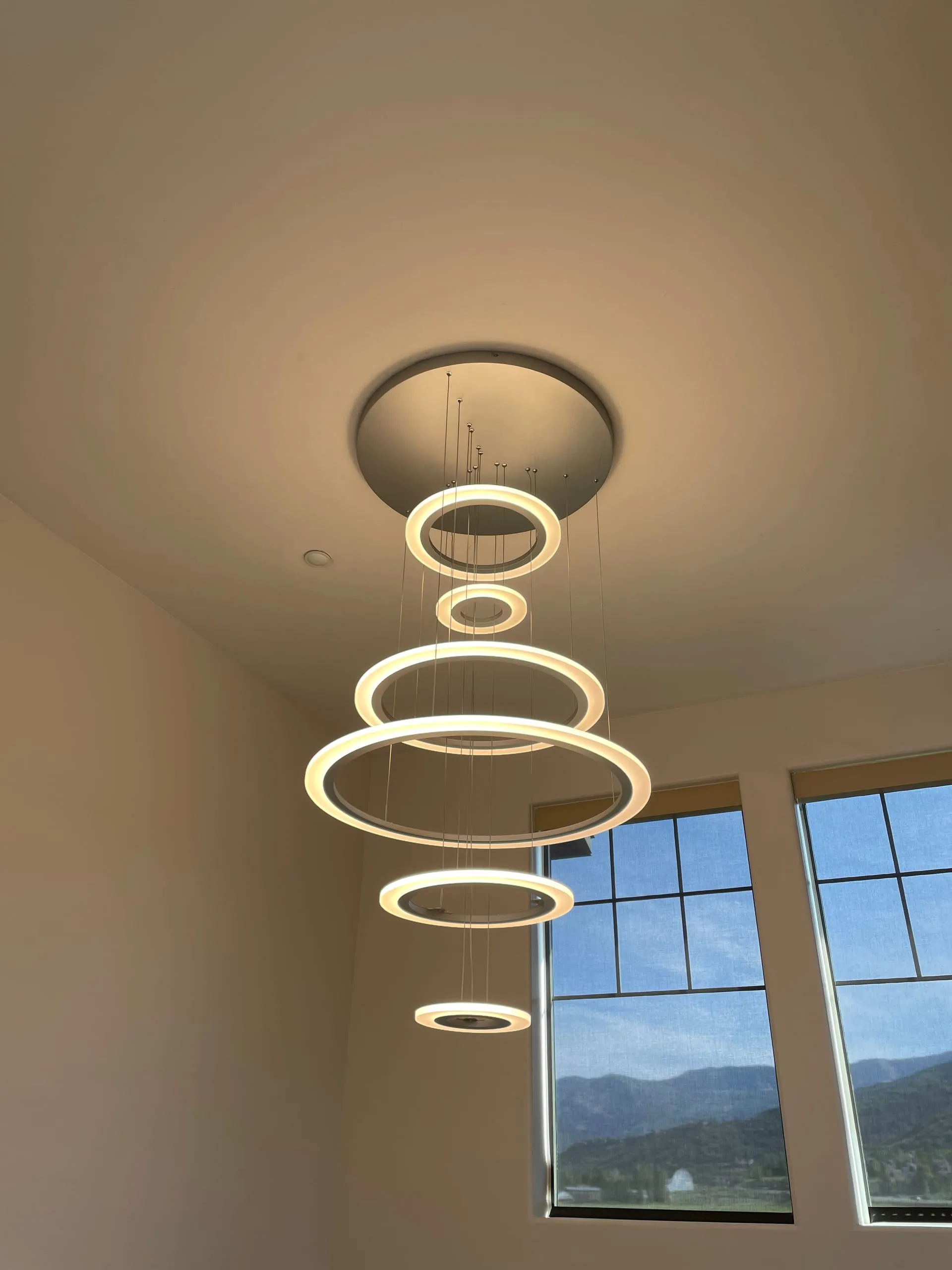 Stairwell ring chandelier mountain view